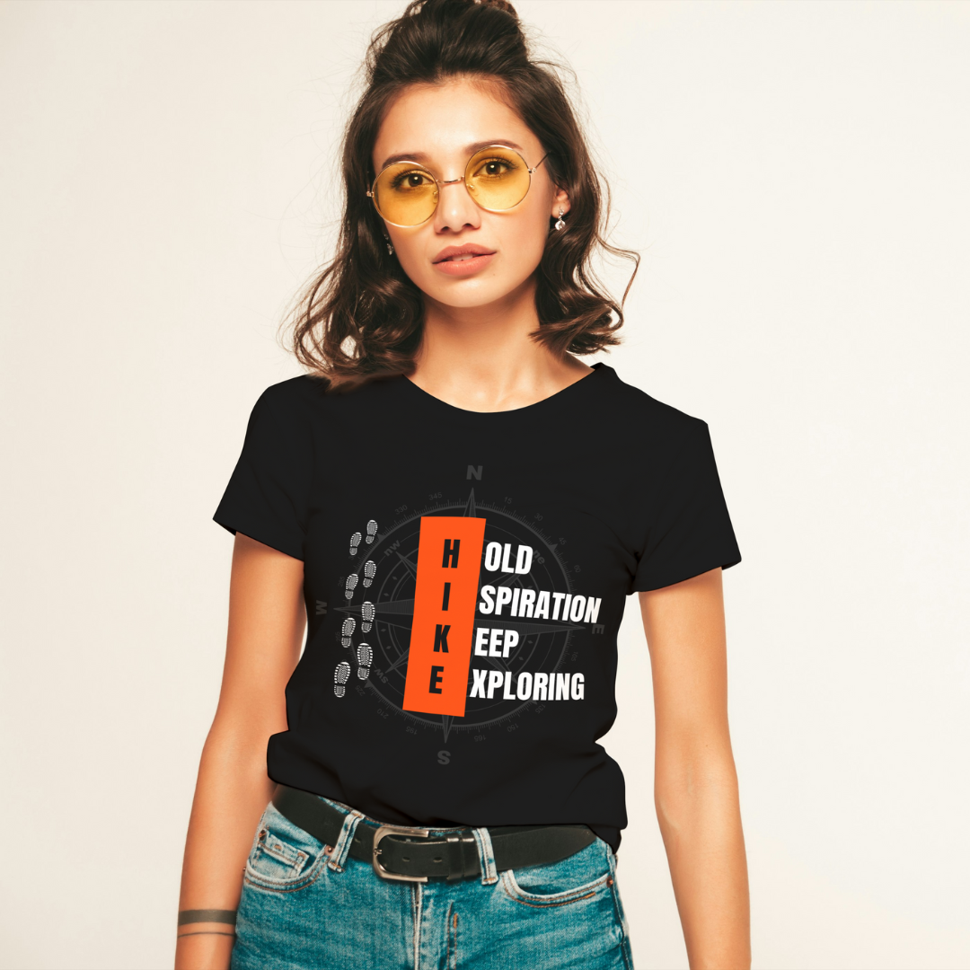 Woman wearing a black t-shirt with outdoor-themed design and text.